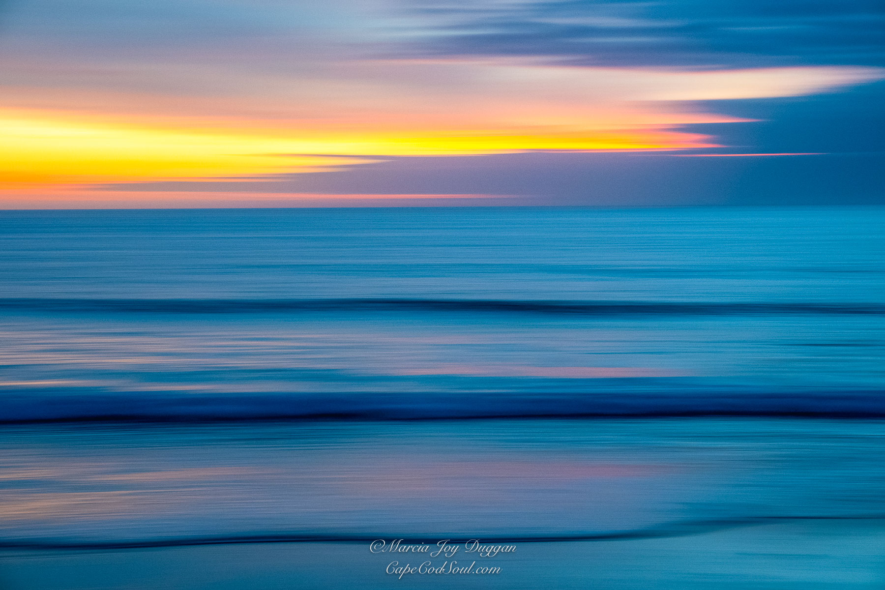 The early morning blue hour at Nauset Beach on Cape Cod with a beautiful reflection at daybreak.