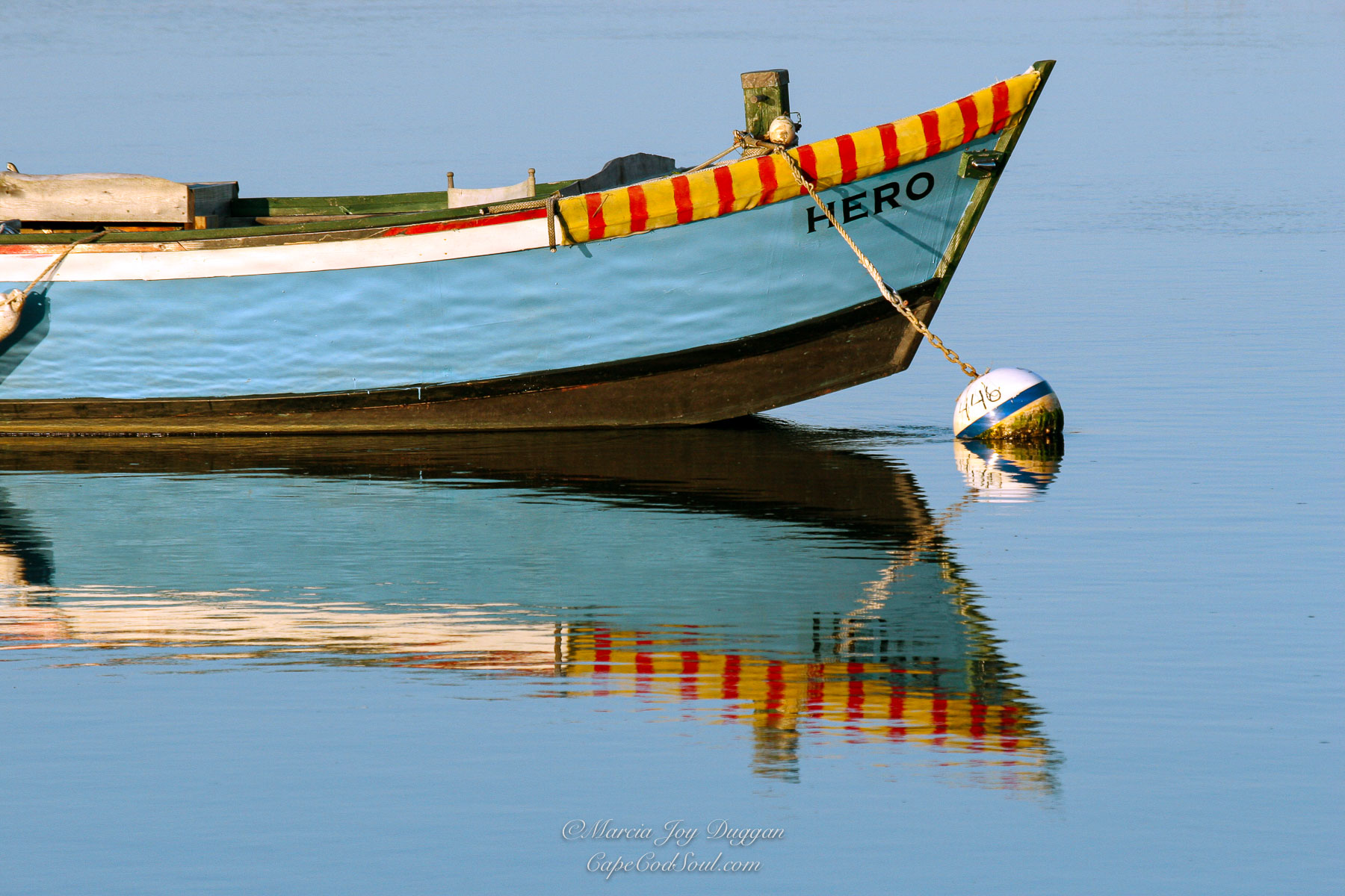 Hero is a photo of the iconic skiff on the Herring River in Harwich on Cape Cod.
